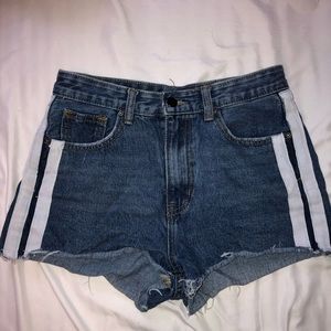 SOLD Nasty Gal blue denim shorts with white stripes on the sides.